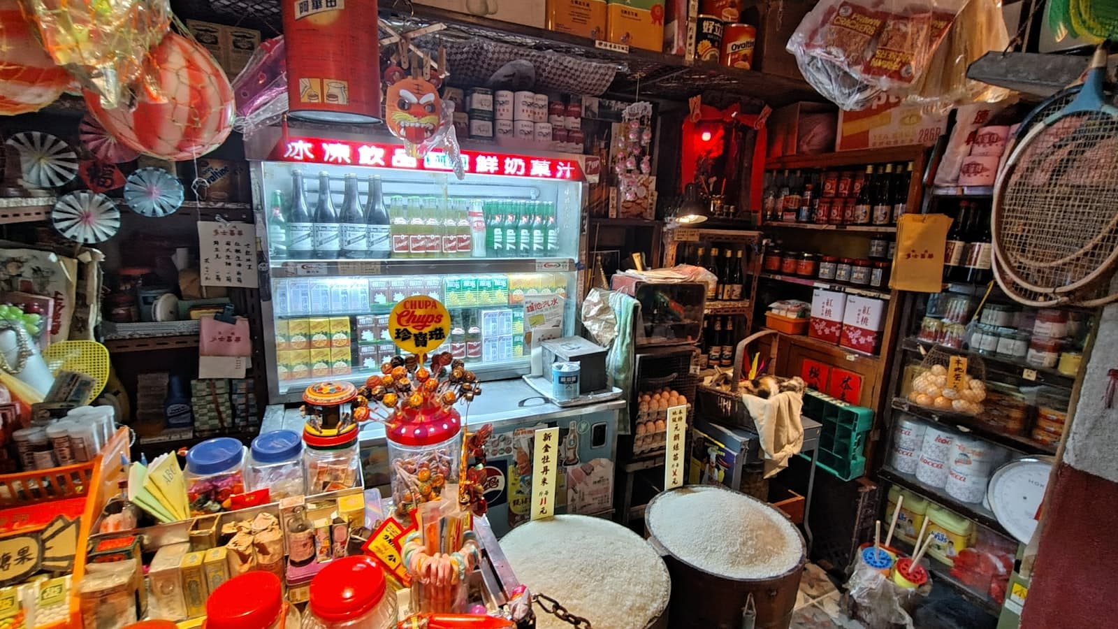 Interior of a small densely stocked neighborhood convenience shop