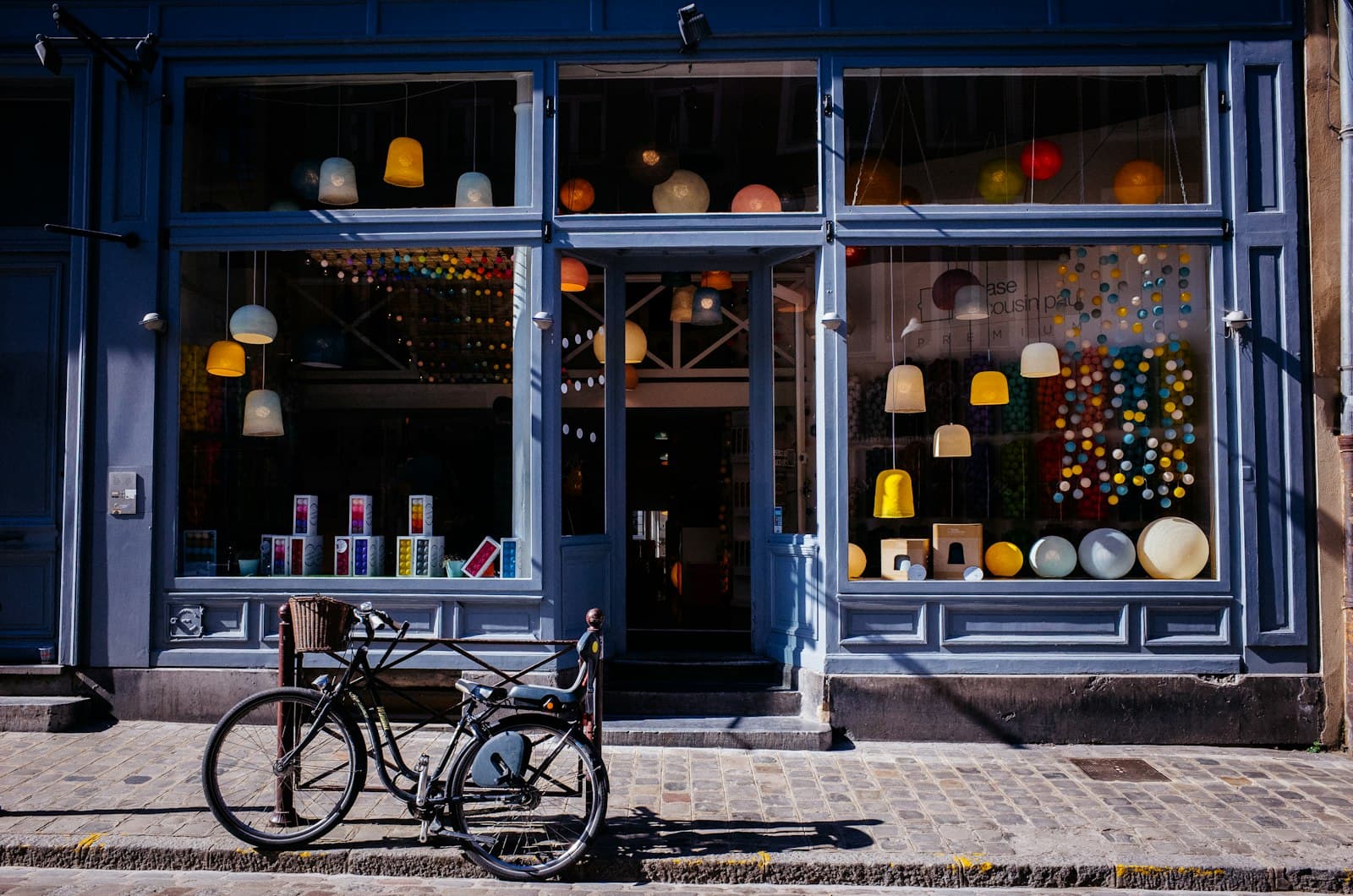 Small retail boutique storefront with glass display windows