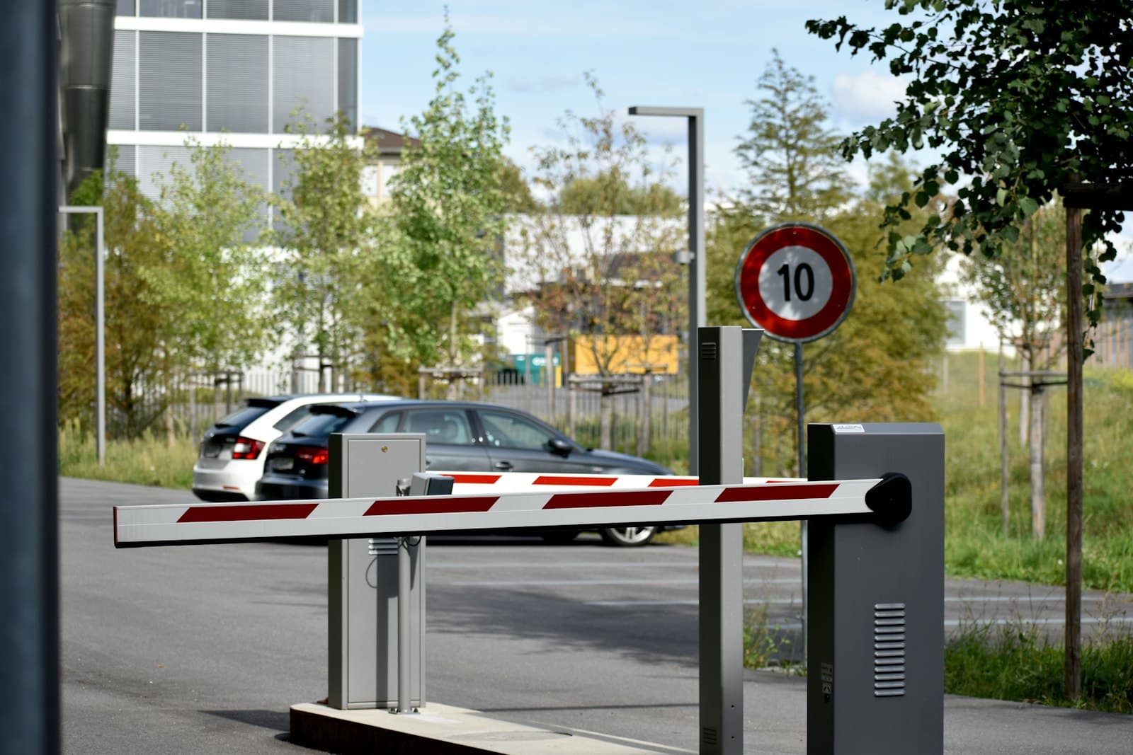 Automated boom gates with access pedestal at a lot entrance